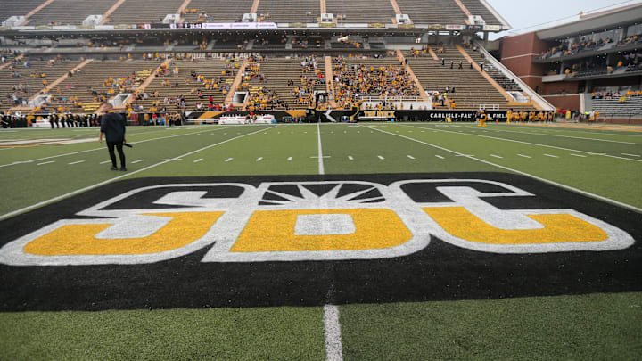 A college football conference is stuck without announcing its program schedules due to an ongoing legal situation.