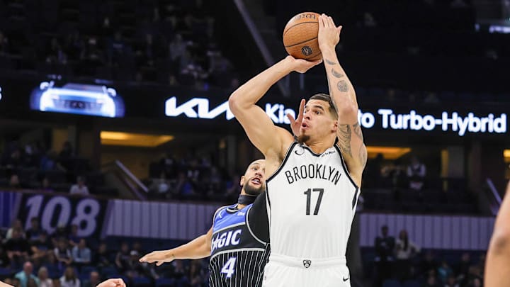 Nov 14, 2025; Orlando, Florida, USA; Brooklyn Nets forward Michael Porter Jr. (17) shoots in front of Orlando Magic guard Jalen Suggs (4) during the first quarter at Kia Center. Mandatory Credit: Mike Watters-Imagn Images