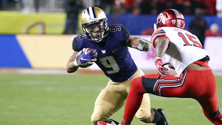 Nov 30, 2018; Santa Clara, CA, USA; Washington Huskies running back Myles Gaskin (9) carries the ball against Utah Utes defensive back Corrion Ballard (15) during the first quarter at Levi's Stadium. Mandatory Credit: Kelley L Cox-Imagn Images