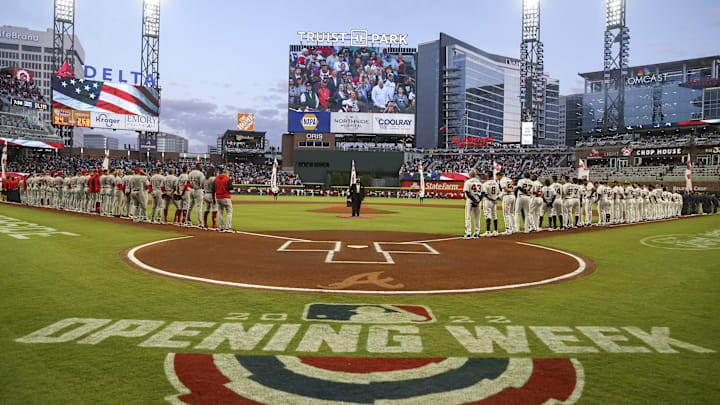 Apr 7, 2022; Atlanta, Georgia, USA; Cincinnati Reds and Atlanta Braves players look on during the