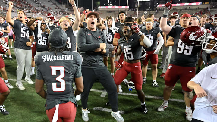 Sep 7, 2024; Pullman, Washington, USA; Washington State Cougars head coach Jake Dickert, center, celebrates with his team after a game against the Texas Tech Red Raiders at Gesa Field at Martin Stadium. Washington State Cougars won 37-16. Mandatory Credit: James Snook-Imagn Images Sep 7, 2024; Pullman, Washington, USA; Washington State Cougars head coach Jake Dickert, center, celebrates with his team after a game against the Texas Tech Red Raiders at Gesa Field at Martin Stadium. Washington State Cougars won 37-16. Mandatory Credit: James Snook-Imagn Images