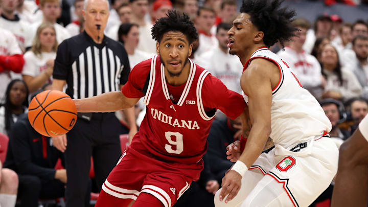 Indiana guard Kanaan Carlyle (9) drives against Ohio State's Ques Glover (6) at Value City Arena. 
