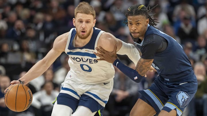 Minnesota Timberwolves guard Donte DiVincenzo dribbles the ball against Memphis Grizzlies guard Ja Morant in the first half at Target Center in Minneapolis on Jan. 11, 2025. Minnesota Timberwolves guard Donte DiVincenzo dribbles the ball against Memphis Grizzlies guard Ja Morant in the first half at Target Center in Minneapolis on Jan. 11, 2025.