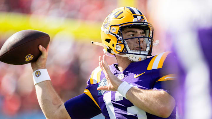 Jan 1, 2024; Tampa, FL, USA; LSU Tigers quarterback Garrett Nussmeier (13) looks to throw during the first half against the Wisconsin Badgers at Raymond James Stadium. Mandatory Credit: Matt Pendleton-USA TODAY Sports