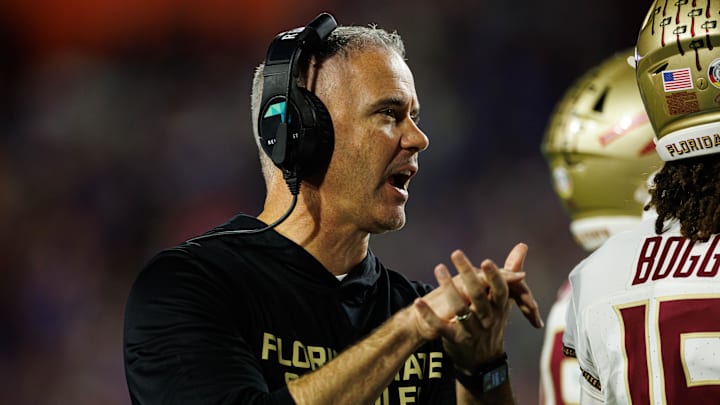 Nov 29, 2025; Gainesville, Florida, USA; Florida State Seminoles head coach Mike Norvell gestures against the Florida Gators during the second half at Ben Hill Griffin Stadium. Mandatory Credit: Matt Pendleton-Imagn Images