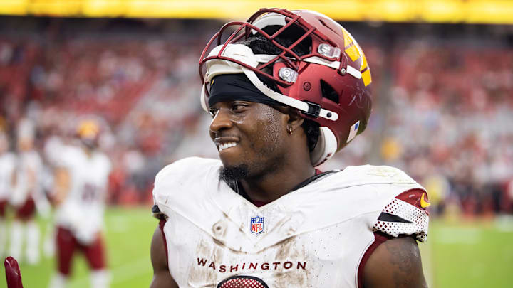Sep 29, 2024; Glendale, Arizona, USA; Washington Commanders running back Brian Robinson Jr. (8) against the Arizona Cardinals at State Farm Stadium. Mandatory Credit: Mark J. Rebilas-Imagn Images