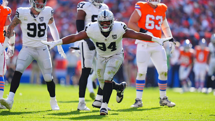 Oct 6, 2024; Denver, Colorado, USA; Las Vegas Raiders defensive tackle Christian Wilkins (94) celebrates his sack in the second quarter against the Denver Broncos at Empower Field at Mile High. Mandatory Credit: Ron Chenoy-Imagn Images