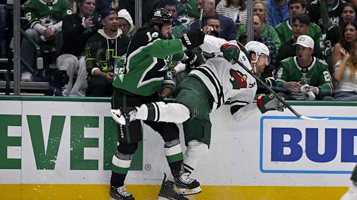 Apr 28, 2026; Dallas, Texas, USA; Dallas Stars left wing Jamie Benn (14) checks Minnesota Wild left wing Marcus Foligno (17) during the second period in game five of the first round of the 2026 Stanley Cup Playoffs at American Airlines Center. Mandatory Credit: Jerome Miron-Imagn Images