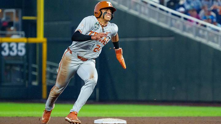 Texas Longhorns shortstop Adrian Rodriguez advances to third on an error against the Georgia Bulldogs in the College World Series.