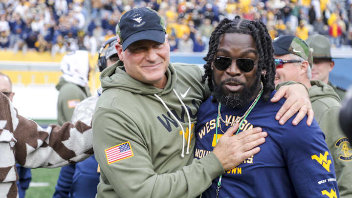 Nov 8, 2025; Morgantown, West Virginia, USA; West Virginia Mountaineers head coach Rich Rodriguez celebrates after defeating the Colorado Buffaloes at Milan Puskar Stadium. Mandatory Credit: Ben Queen-Imagn Images Nov 8, 2025; Morgantown, West Virginia, USA; West Virginia Mountaineers head coach Rich Rodriguez celebrates after defeating the Colorado Buffaloes at Milan Puskar Stadium. Mandatory Credit: Ben Queen-Imagn Images