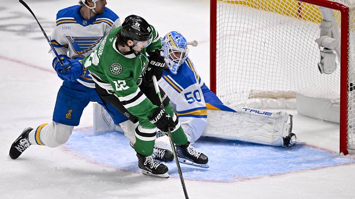 Feb 4, 2026; Dallas, Texas, USA; Dallas Stars center Mavrik Bourque (22) scores a goal against St. Louis Blues goaltender Jordan Binnington (50) during the second period at the American Airlines Center. Mandatory Credit: Jerome Miron-Imagn Images