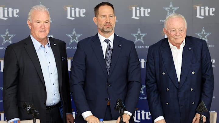 Dallas Cowboys CEO Stephen Jones, head coach Brian Schottenheimer and owner Jerry Jones pose for pictures after a press conference at the Star.  