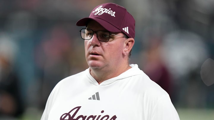 Dec 27, 2024; Las Vegas, NV, USA; Texas A&M Aggies head coach Mike Elko reacts against the Southern California Trojans in the first half at Allegiant Stadium. Mandatory Credit: Kirby Lee-Imagn Images