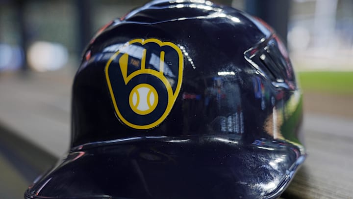 Jun 10, 2024; Milwaukee, Wisconsin, USA; A Milwaukee Brewers batting helmet sits on the bench during batting practice prior to the game against the Toronto Blue Jays at American Family Field. Mandatory Credit: Jeff Hanisch-Imagn Images Jun 10, 2024; Milwaukee, Wisconsin, USA; A Milwaukee Brewers batting helmet sits on the bench during batting practice prior to the game against the Toronto Blue Jays at American Family Field. Mandatory Credit: Jeff Hanisch-Imagn Images