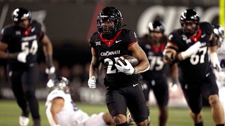 Nov 30, 2024; Cincinnati, Ohio, USA; Cincinnati Bearcats running back Corey Kiner (21) runs to the 1-yard line against the TCU Horned Frogs in the second quarter at Nippert Stadium. Mandatory Credit: Albert Cesare/USA TODAY Network via Imagn Images