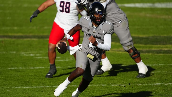 Nov 11, 2023; Boulder, Colorado, USA; Colorado Buffaloes quarterback Shedeur Sanders (2) carries the ball in the second half against the Arizona Wildcats at Folsom Field. Mandatory Credit: Ron Chenoy-USA TODAY Sports