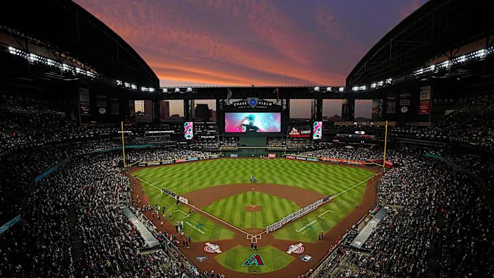 The sun sets as Diamondbacks players are introduced during Opening Day 2024 at Chase Field.