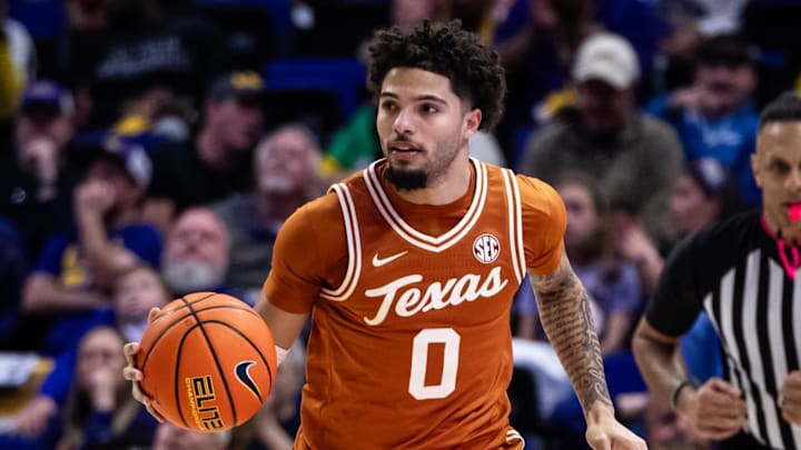 Feb 1, 2025; Baton Rouge, Louisiana, USA;  Texas Longhorns guard Jordan Pope (0) brings the ball up court against the LSU Tigers during the second half at Pete Maravich Assembly Center. Mandatory Credit: Stephen Lew-Imagn Images