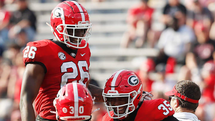 Georgia outside linebacker Damon Wilson Jr. (35) celebrates with Georgia outside linebacker Samuel M'Pemba (26) and Georgia inside linebacker Terrell Foster (30) after getting a sack during the UGA G-Day spring football game at Sanford Stadium in Athens, Ga., on Saturday, April 15, 2023. Red won 31-26.News Joshua L Jones