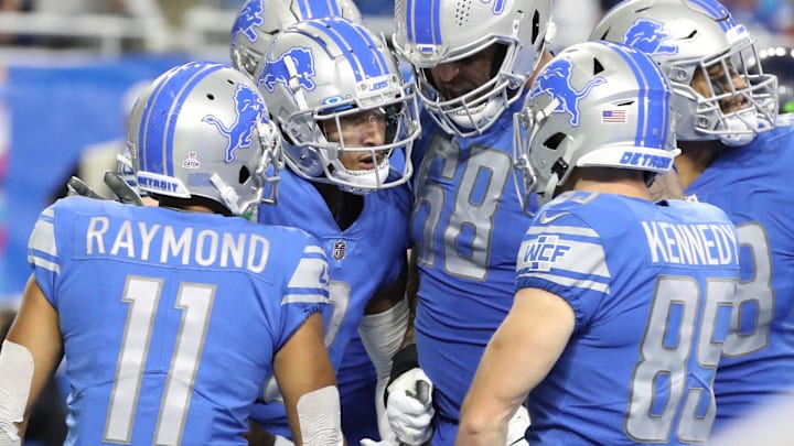 Detroit Lions receiver Josh Reynolds (8) celebrates his touchdown with teammates during the second