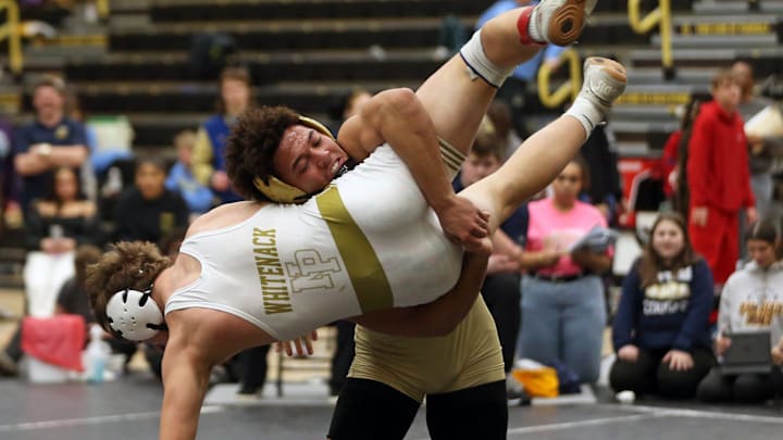 Penn junior Vinny Freeman lifts New Prairie senior Hayden Whitenack off the ground during the 175-pound championship match at the NIC invitational Saturday, Jan. 18, 2025, at Penn High School in Mishawaka.