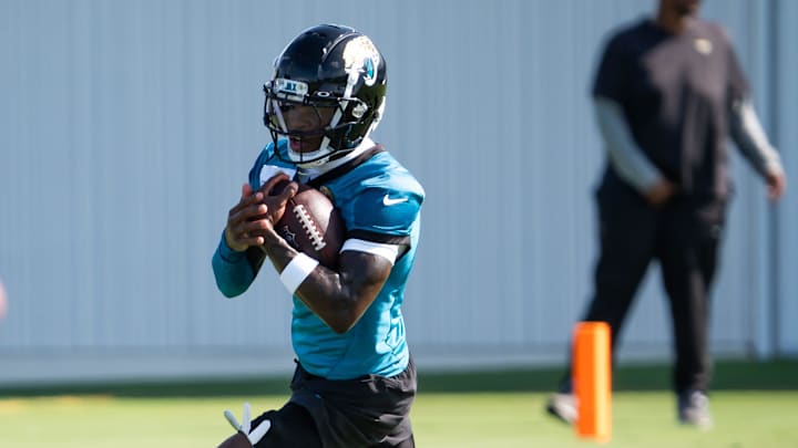 Jacksonville Jaguars wide receiver Travis Hunter (12) turns upfield after hauling in a pass during the Jacksonville Jaguars’ third mandatory minicamp Thursday June 12, 2025 at the Miller Electric Center in Jacksonville, Fla. 