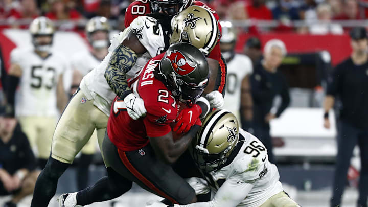 New Orleans Saints linebacker Demario Davis (56) and defensive end Carl Granderson (96) stuff a play against the Tampa Bay Buccaneers New Orleans Saints linebacker Demario Davis (56) and defensive end Carl Granderson (96) stuff a play against the Tampa Bay Buccaneers