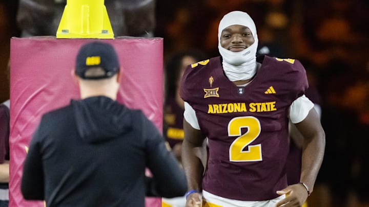 Nov 28, 2025; Tempe, Arizona, USA; Arizona State Sun Devils quarterback Jeff Sims (2) with head coach Kenny Dillingham against the Arizona Wildcats during the 99th Territorial Cup at Mountain America Stadium. Mandatory Credit: Mark J. Rebilas-Imagn Images