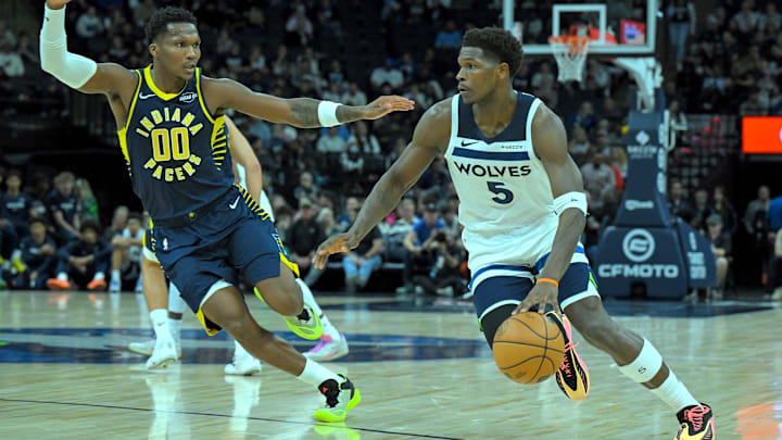 Oct 7, 2025; Minneapolis, Minnesota, USA; Minnesota Timberwolves guard Anthony Edwards (5) drives to the basket as Indiana Pacers forward Bennedict Mathurin (00) defends during the second quarter at Target Center. Oct 7, 2025; Minneapolis, Minnesota, USA; Minnesota Timberwolves guard Anthony Edwards (5) drives to the basket as Indiana Pacers forward Bennedict Mathurin (00) defends during the second quarter at Target Center.