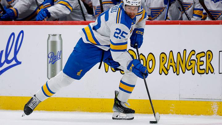 Apr 5, 2026; Denver, Colorado, USA; St. Louis Blues right wing Jordan Kyrou (25) controls the puck in the third period against the Colorado Avalanche at Ball Arena. Mandatory Credit: Isaiah J. Downing-Imagn Images