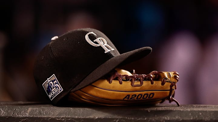 May 10, 2018; Denver, CO, USA; A detail view of a Colorado Rockies players hat and glove in the fifth inning against the Milwaukee Brewers at Coors Field. 
