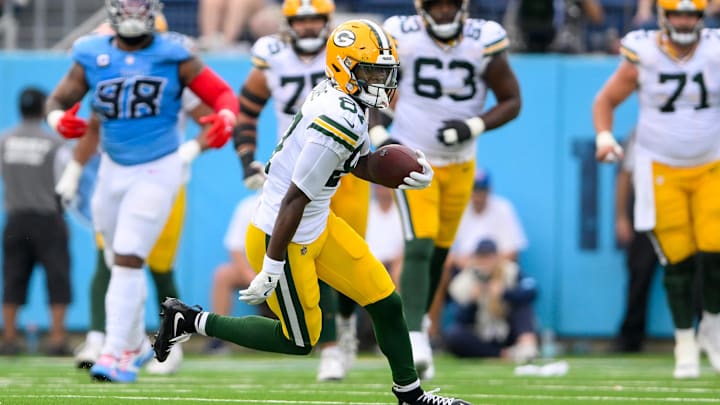 Sep 22, 2024; Nashville, Tennessee, USA;  Green Bay Packers wide receiver Romeo Doubs (87) makes a catch and runs the ball against the Tennessee Titans during the first half at Nissan Stadium. Mandatory Credit: Steve Roberts-Imagn Images