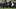 Quarterback Aidan Chiles throws downfield as Michigan Wolverines defensive lineman Enow Etta defends