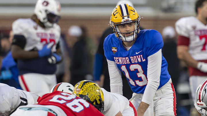 Jan 28, 2026; Mobile, AL, USA; American Team quarterback Garrett Nussmeier (13) of LSU runs a play during American Senior Bowl practice at Hancock Whitney Stadium. 