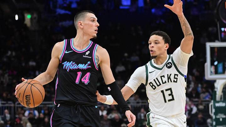 Feb 24, 2026; Milwaukee, Wisconsin, USA;  Miami Heat guard Tyler Herro (14) looks for a shot against Milwaukee Bucks guard Ryan Rollins (13) in the fourth quarter at Fiserv Forum. Mandatory Credit: Benny Sieu-Imagn Images