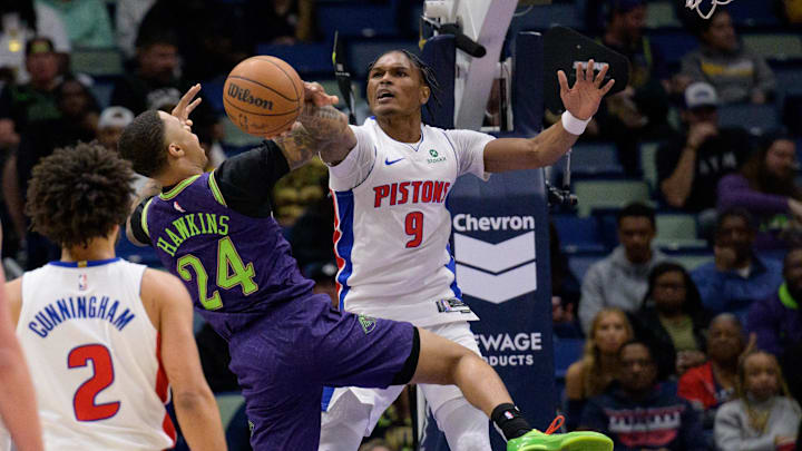 Mar 17, 2025; New Orleans, Louisiana, USA; Detroit Pistons forward Ausar Thompson (9) blocks a shot by New Orleans Pelicans guard Jordan Hawkins (24) during the first half at Smoothie King Center. Mandatory Credit: Matthew Hinton-Imagn Images