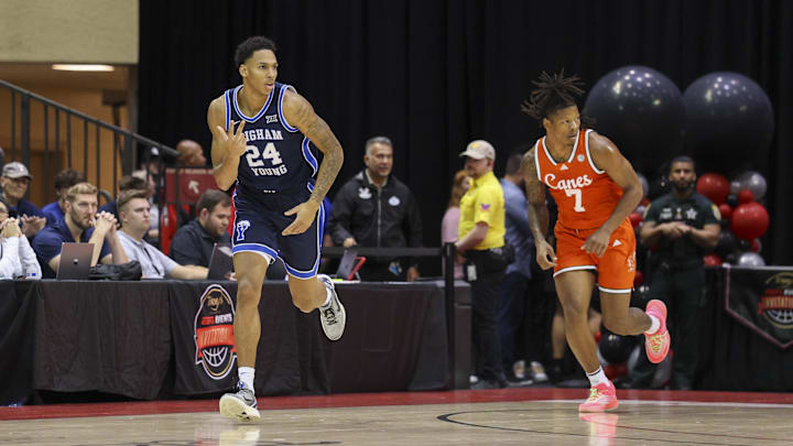 Nov 27, 2025; Kissimmee, Florida, USA; Brigham Young University Cougars forward Dominique Diomande (24) reacts after a basket against the Miami (FL) Hurricanes in the first half at State Farm Field House. Mandatory Credit: Nathan Ray Seebeck-Imagn Images