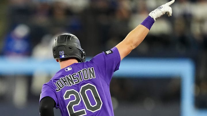 Colorado Rockies Troy Johnston (20) celebrates after hitting a home run. 