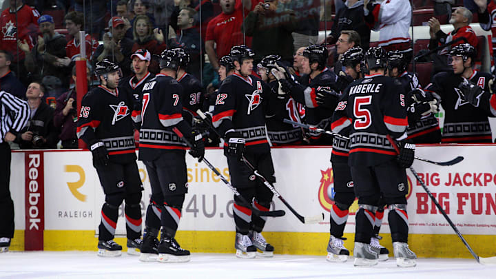 April 7, 2009; Raleigh, NC, USA; Carolina Hurricanes center (12) Eric Staal is congratulated by his teammates after his 1st period goal against the New York Islanders at the RBC Center. Mandatory Credit: James Guillory-Imagn Images