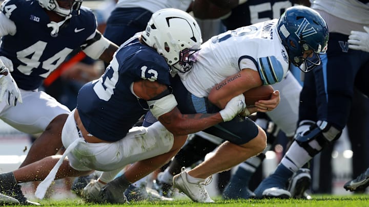 Penn State football linebacker Tony Rojas (13) sacks Villanova Wildcats quarterback Tanner Maddocks (3) 