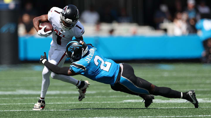 Sep 21, 2025; Charlotte, North Carolina, USA; Atlanta Falcons wide receiver Darnell Mooney (1) runs the ball with Carolina Panthers cornerback Mike Jackson (2) defending during the first half at Bank of America Stadium. Mandatory Credit: Cory Knowlton-Imagn Images Sep 21, 2025; Charlotte, North Carolina, USA; Atlanta Falcons wide receiver Darnell Mooney (1) runs the ball with Carolina Panthers cornerback Mike Jackson (2) defending during the first half at Bank of America Stadium. Mandatory Credit: Cory Knowlton-Imagn Images