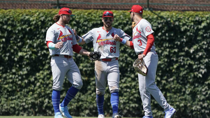 Jun 16, 2024; Chicago, Illinois, USA; St. Louis Cardinals outfielder Brendan Donovan (33) outfielder Michael Siani (63) and Cardinals outfielder Dylan Carlson (3) celebrate their win against the Chicago Cubs at Wrigley Field. Mandatory Credit: David Banks-USA TODAY Sports