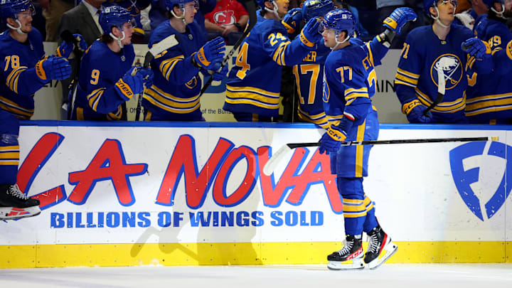 Feb 2, 2025; Buffalo, New York, USA;  Buffalo Sabres right wing JJ Peterka (77) celebrates his goal with teammates during the first period against the New Jersey Devils at KeyBank Center. Mandatory Credit: Timothy T. Ludwig-Imagn Images