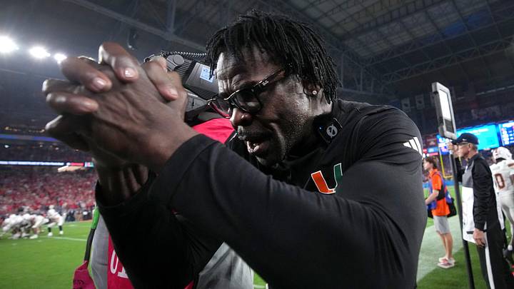 Michael Irvin reacts on the sidelines after the Miami Hurricanes score the winning touchdown against the Ole Miss Rebels during their Vrbo Fiesta Bowl matchup at State Farm Stadium on Jan. 8, 2026. Michael Irvin reacts on the sidelines after the Miami Hurricanes score the winning touchdown against the Ole Miss Rebels during their Vrbo Fiesta Bowl matchup at State Farm Stadium on Jan. 8, 2026.
