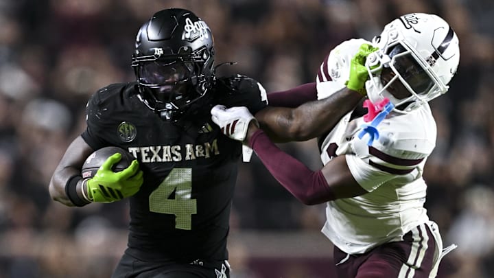 Oct 4, 2025; College Station, Texas, USA; Texas A&M Aggies running back Rueben Owens II (4) stiff arms Mississippi State Bulldogs safety Jahron Manning (13) during the fourth quarter at Kyle Field. Mandatory Credit: Maria Lysaker-Imagn Images Oct 4, 2025; College Station, Texas, USA; Texas A&M Aggies running back Rueben Owens II (4) stiff arms Mississippi State Bulldogs safety Jahron Manning (13) during the fourth quarter at Kyle Field. Mandatory Credit: Maria Lysaker-Imagn Images