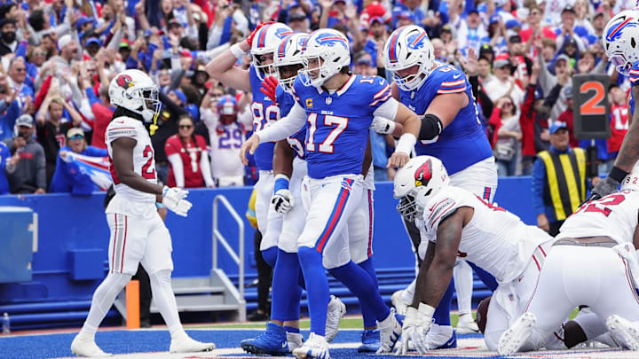Sep 8, 2024; Orchard Park, New York, USA; Buffalo Bills quarterback Josh Allen (17) celebrates scoring a touchdown with teammates against the Arizona Cardinals during the second half at Highmark Stadium. Sep 8, 2024; Orchard Park, New York, USA; Buffalo Bills quarterback Josh Allen (17) celebrates scoring a touchdown with teammates against the Arizona Cardinals during the second half at Highmark Stadium.