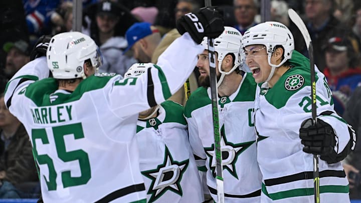 Jan 7, 2025; New York, New York, USA;  Dallas Stars left wing Jason Robertson (21) and Dallas Stars defenseman Thomas Harley (55) celebrate the game winning goal against the New York Rangers by Dallas Stars left wing Jamie Benn (14) during the overtime period at Madison Square Garden. Mandatory Credit: Dennis Schneidler-Imagn Images