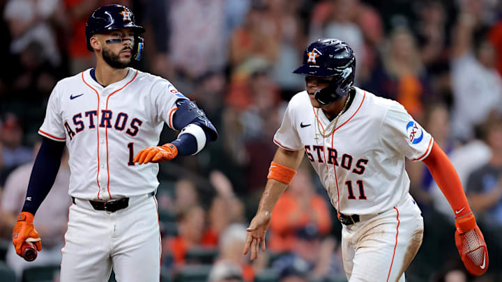 Aug 16, 2025; Houston, Texas, USA; Houston Astros right fielder Cam Smith (11) is greeted by third baseman Carlos Correa (1) after scoring a run against the Baltimore Orioles during the fourth inning at Daikin Park.