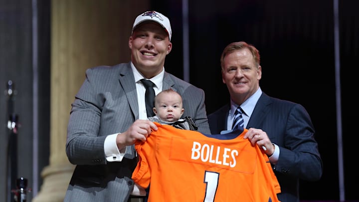 Garett Bolles (Utah) holds his son Kingston Bolles as he poses with NFL commissioner Roger Goodell as he is selected as the number 20 overall pick to the Denver Broncos in the first round the 2017 NFL Draft.