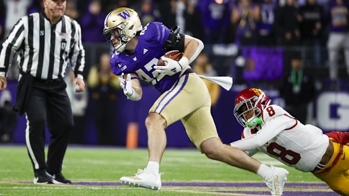 Husky linebacker Carson Bruener (42) comes up with his second interception against USC in the third quarter. 